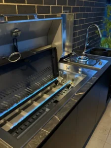 Photo by Ashley Newell on June 15, 2026. May be an image of range hood, stove, cooker, countertop, grill, kitchen and text.
